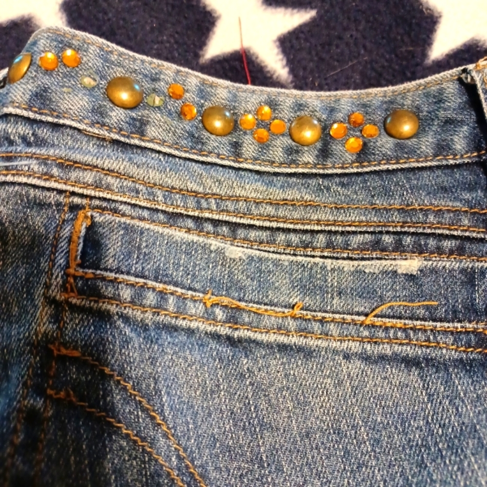 Flare jeans with studs and rhinestones